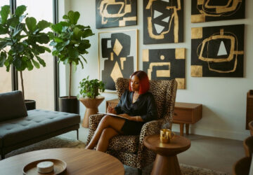 woman sitting in living room writing in journal